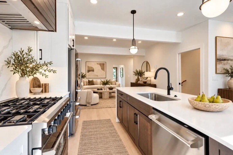 Kitchen with stained island and white walls