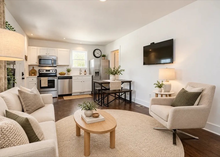 Open living room and white kitchen