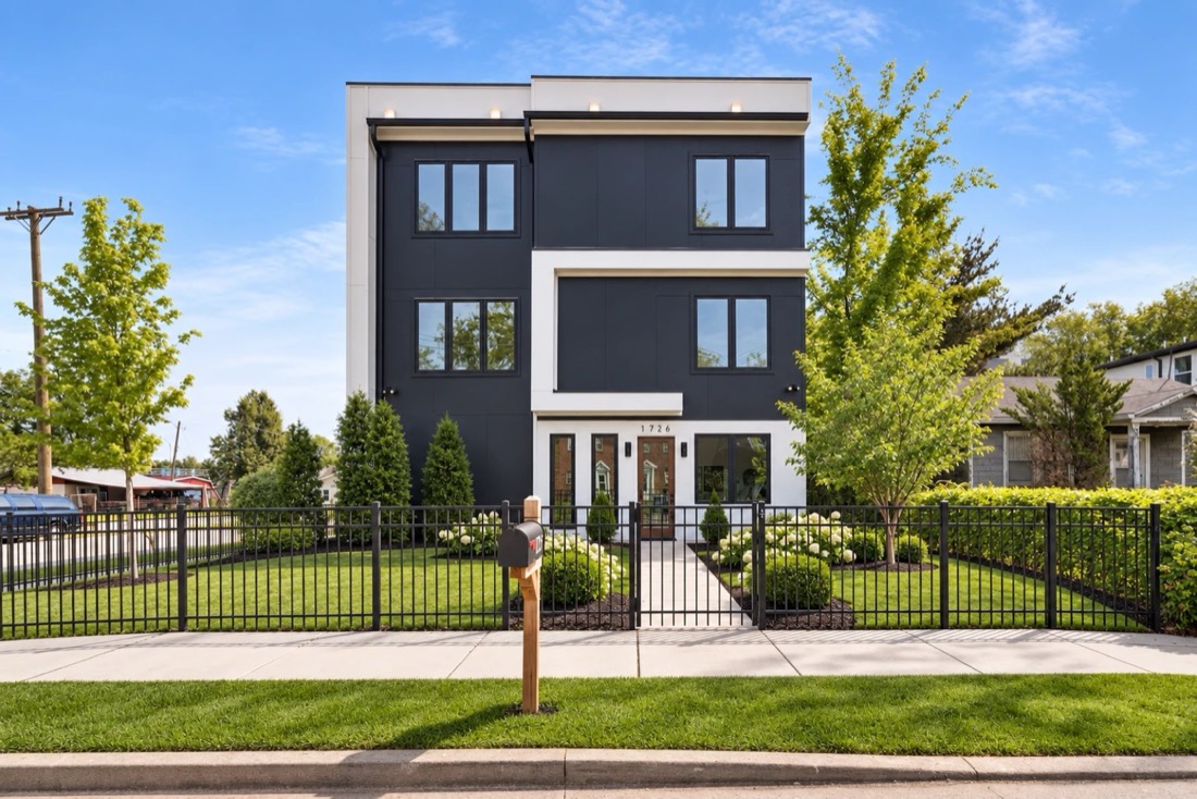 Three-story modern home in black and white panels