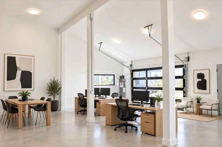 Bright white office interior with glass garage door